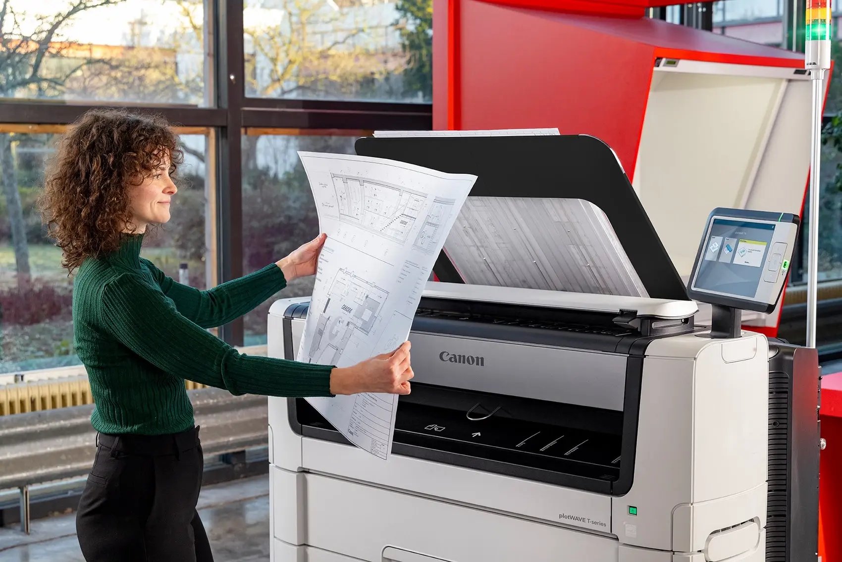 Women using a Canon wide format printer