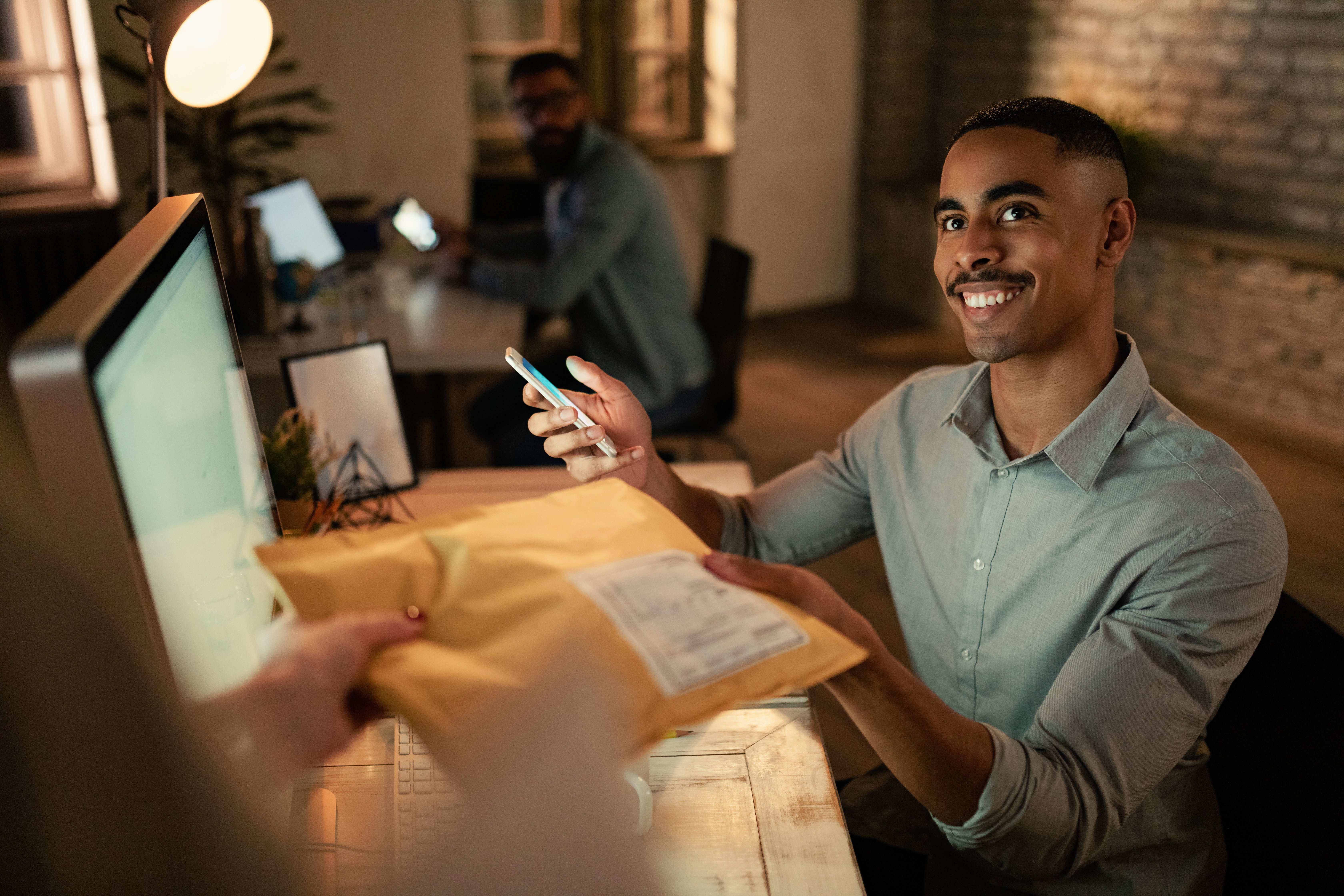 business man hands over parcel