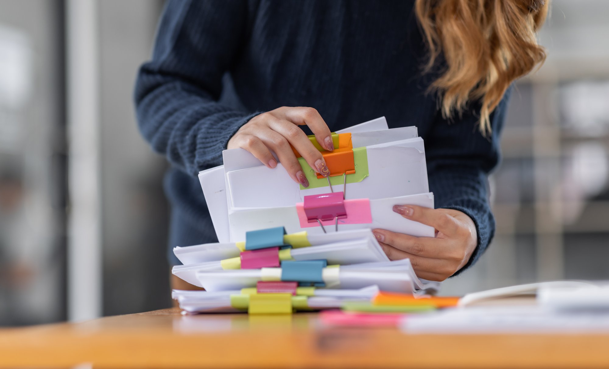 school employee with paper files