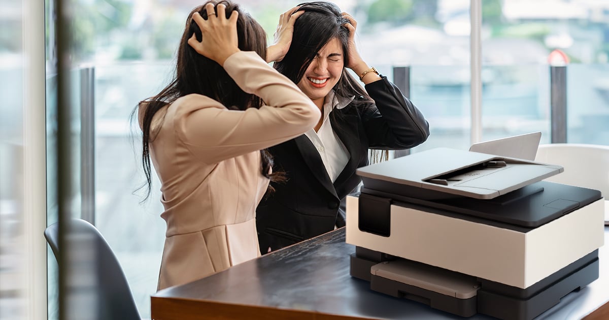 Business professional struggling with a cheap home office printer in a Central California workplace
