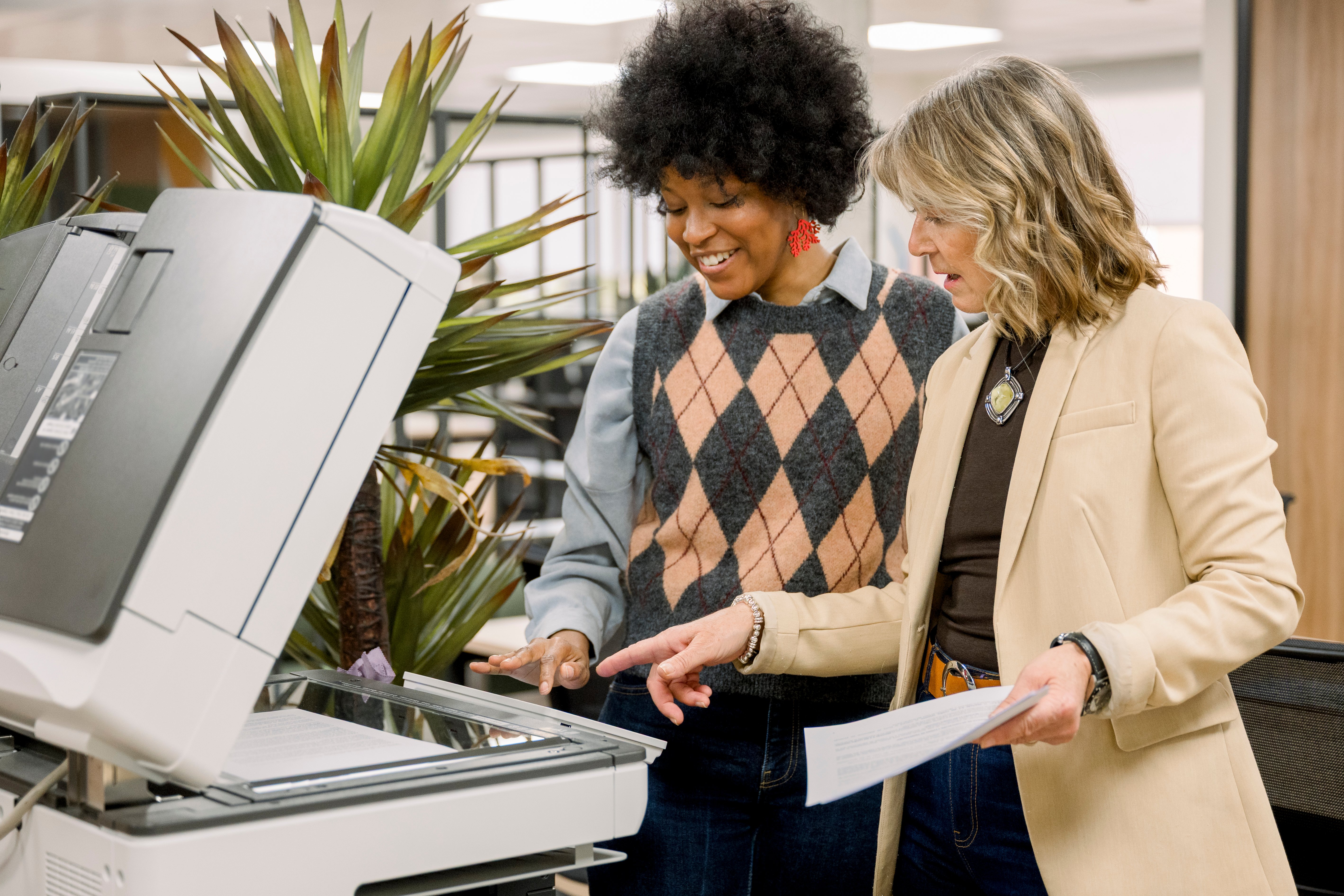 diverse-businesswomen-using-office-photocopier-col-2025-11-27-04-45-25-utc