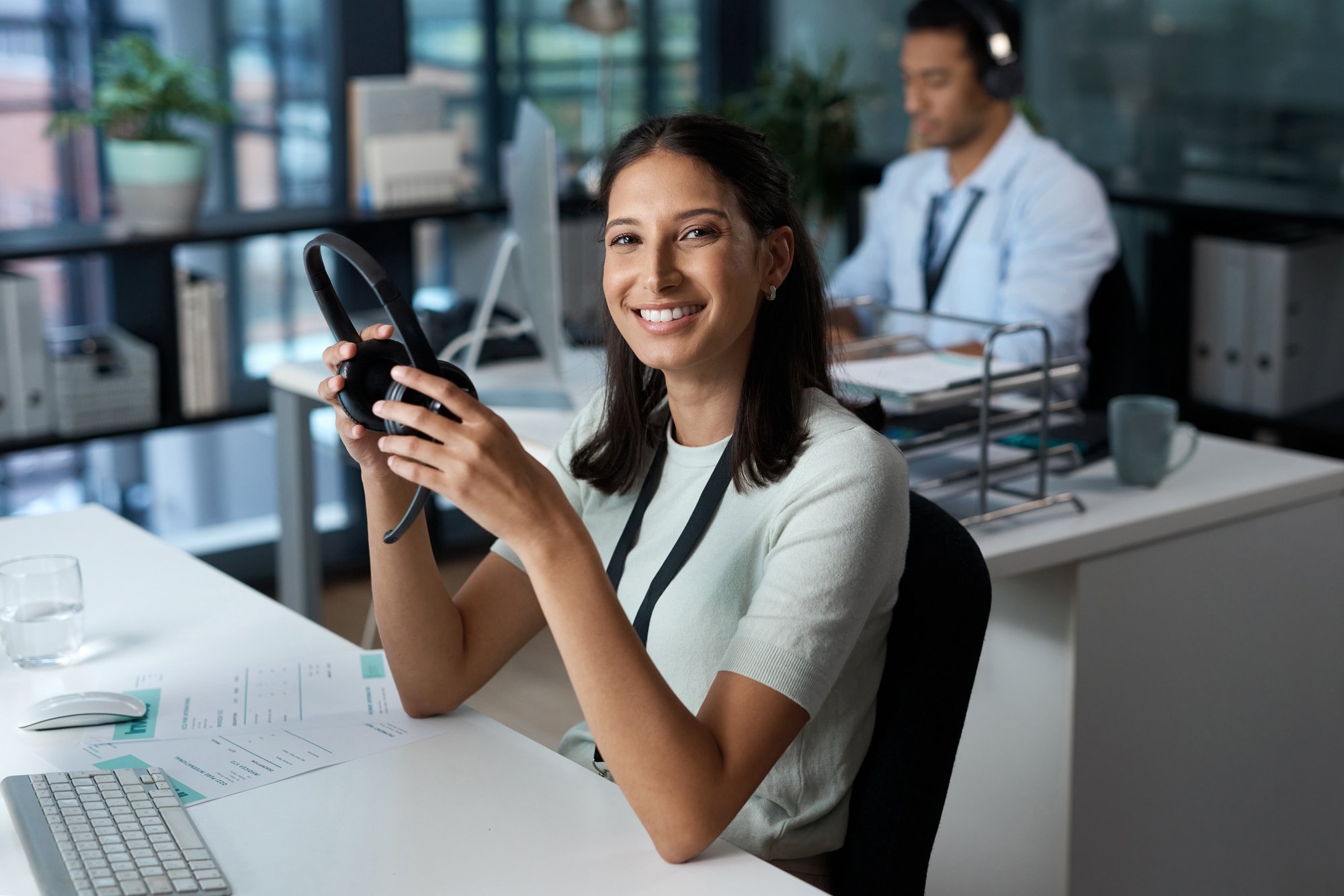 young woman uses headphone with her VoIP