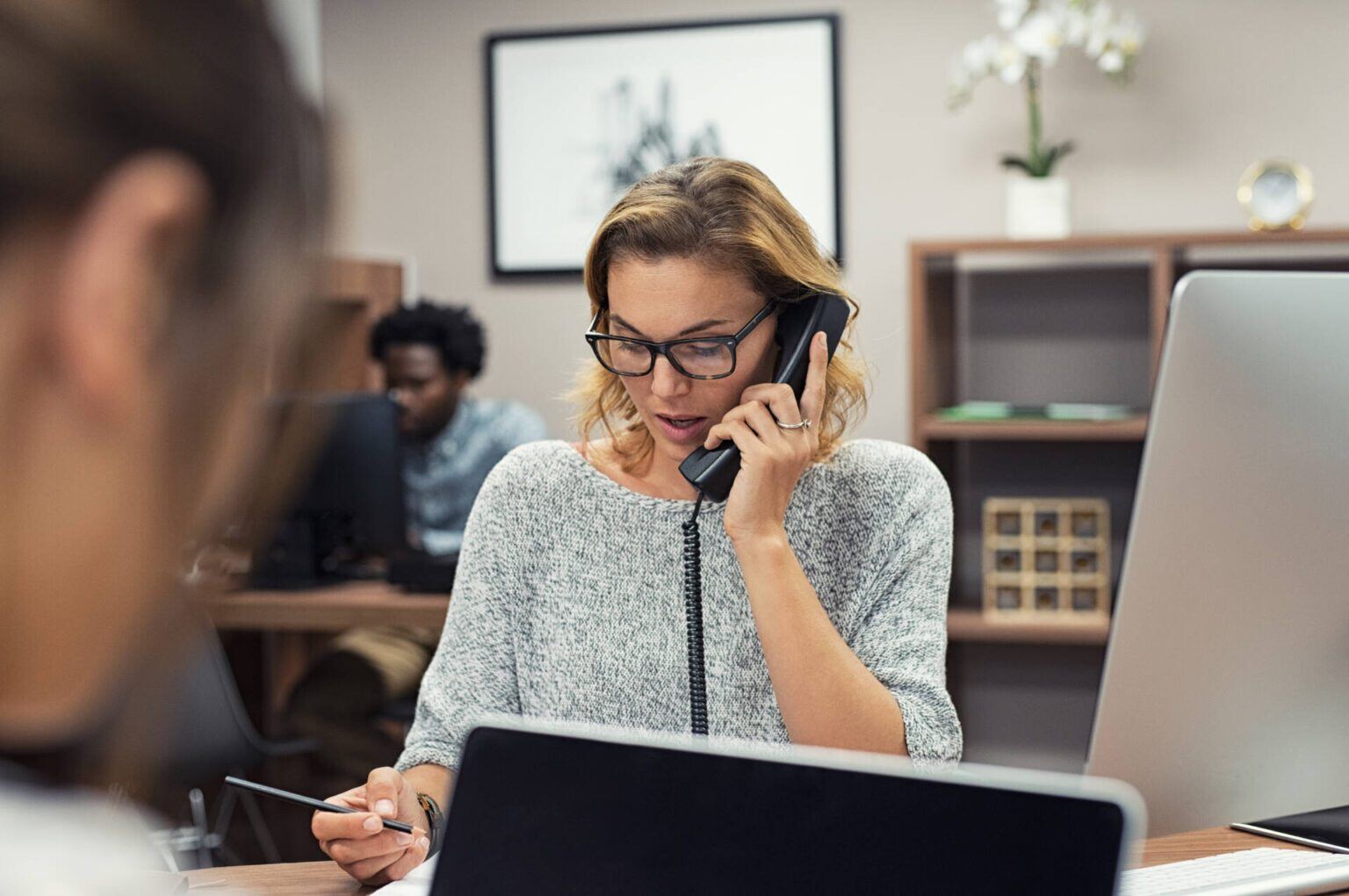 businesswoman-talking-on-phone-at-office-2021-08-26-15-34-41-utc-1536x1020